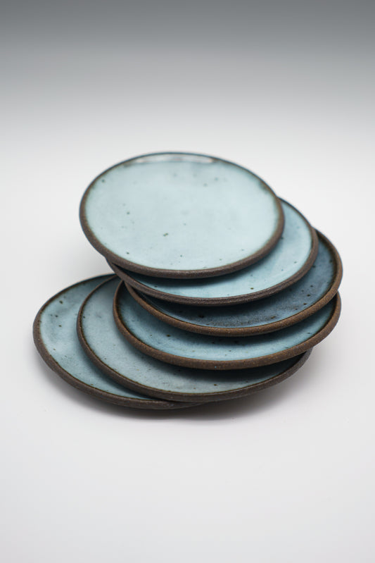 Icy Blue Plate Set on Dark Clay