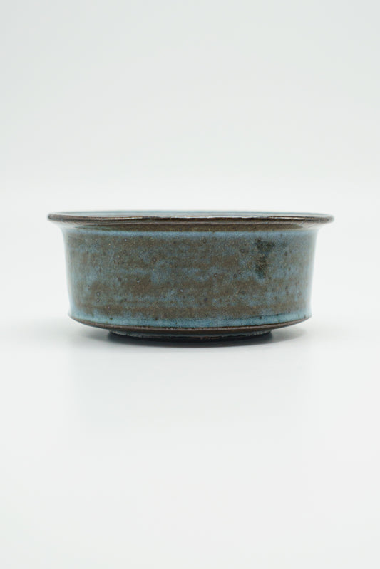 Icy Blue Zoetrope Bowl on Dark Clay