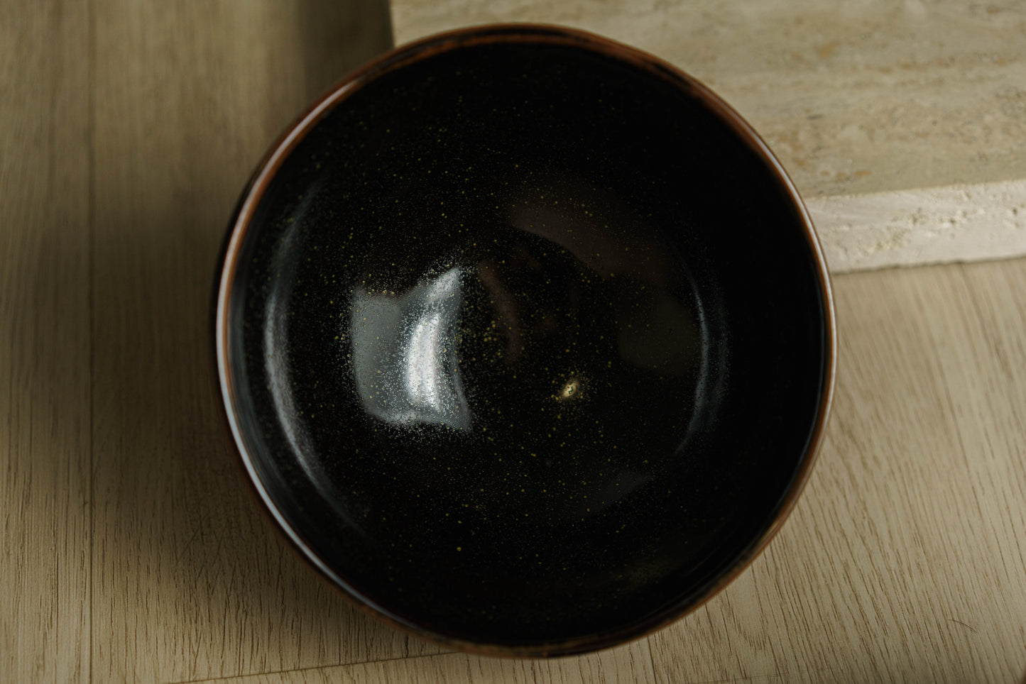 Black Rounded Bowl with Subtle Flecks of Green