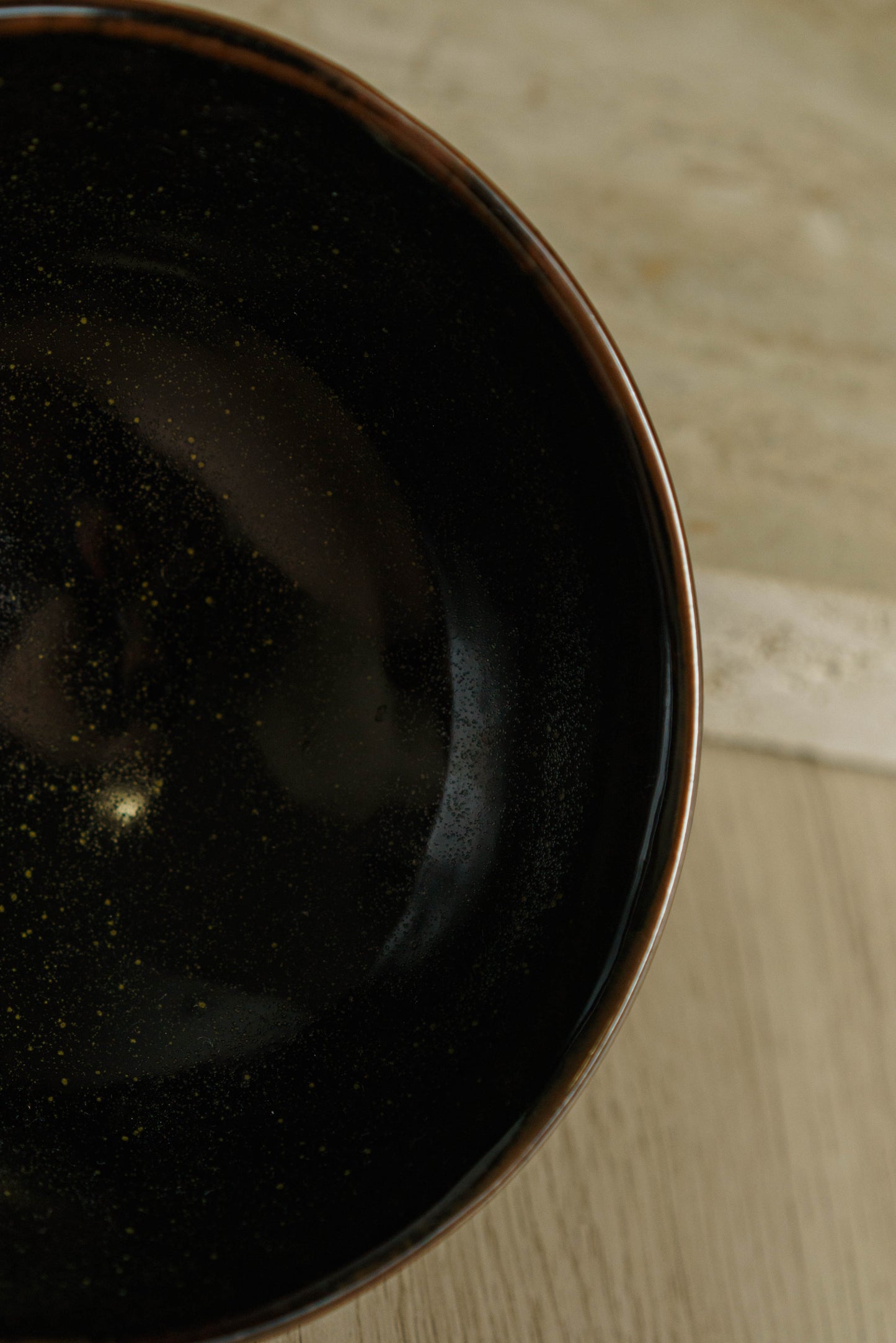 Black Rounded Bowl with Subtle Flecks of Green