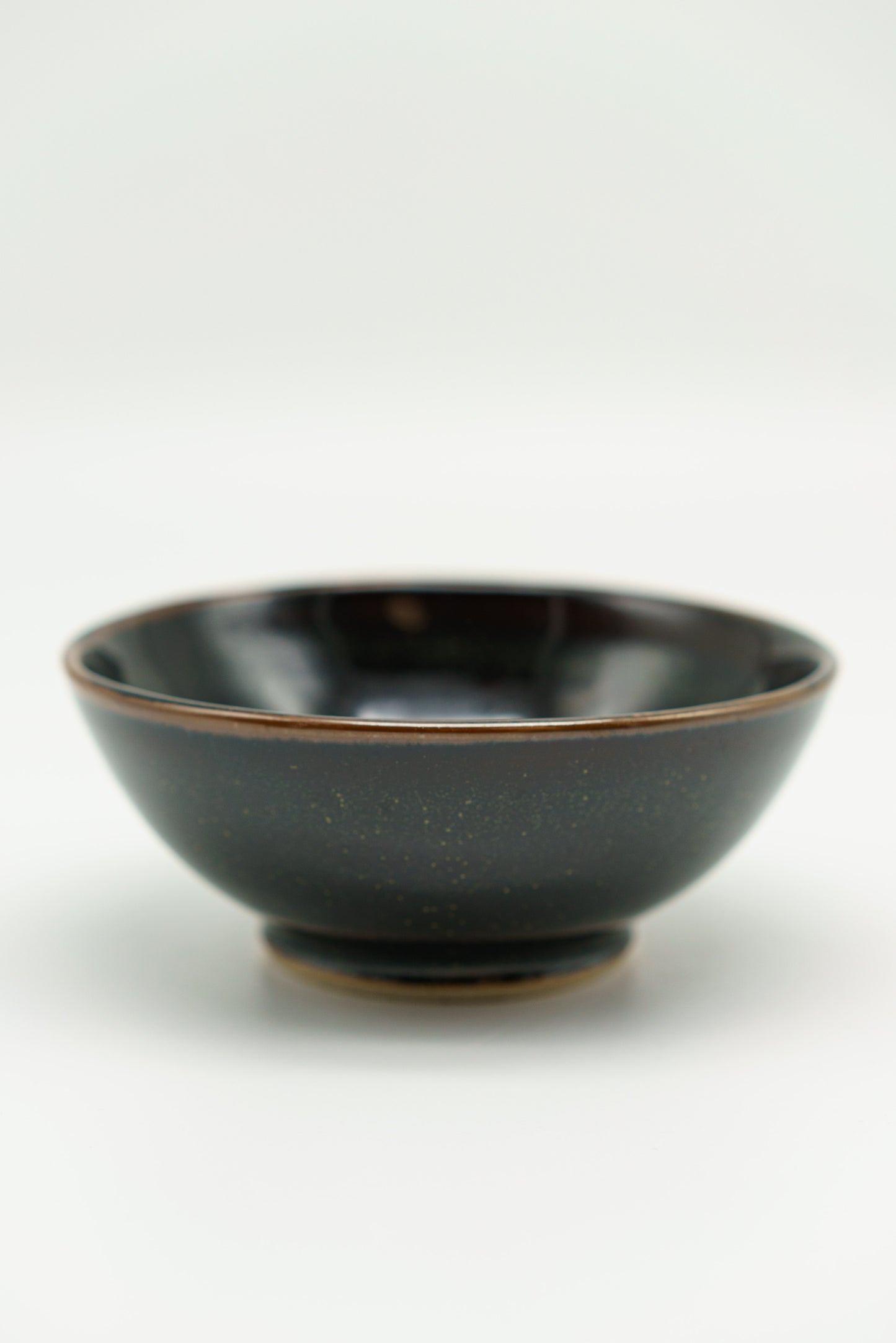 Black Rounded Bowl with Subtle Flecks of Green