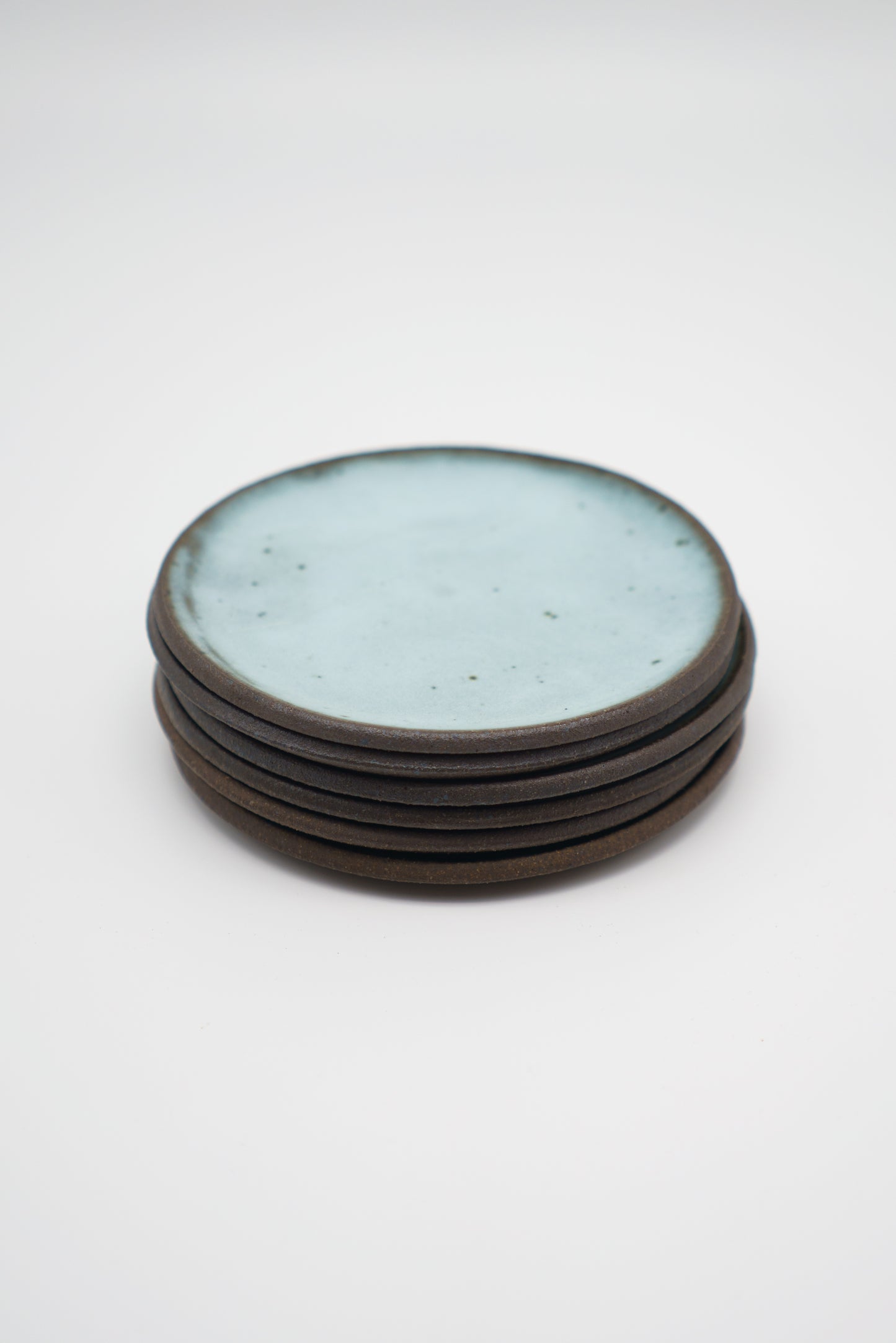 Icy Blue Plate Set on Dark Clay