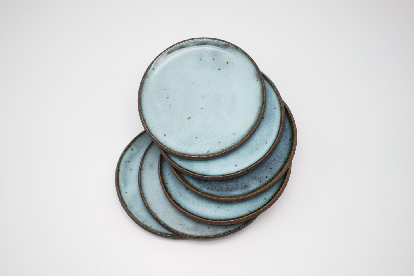 Icy Blue Plate Set on Dark Clay