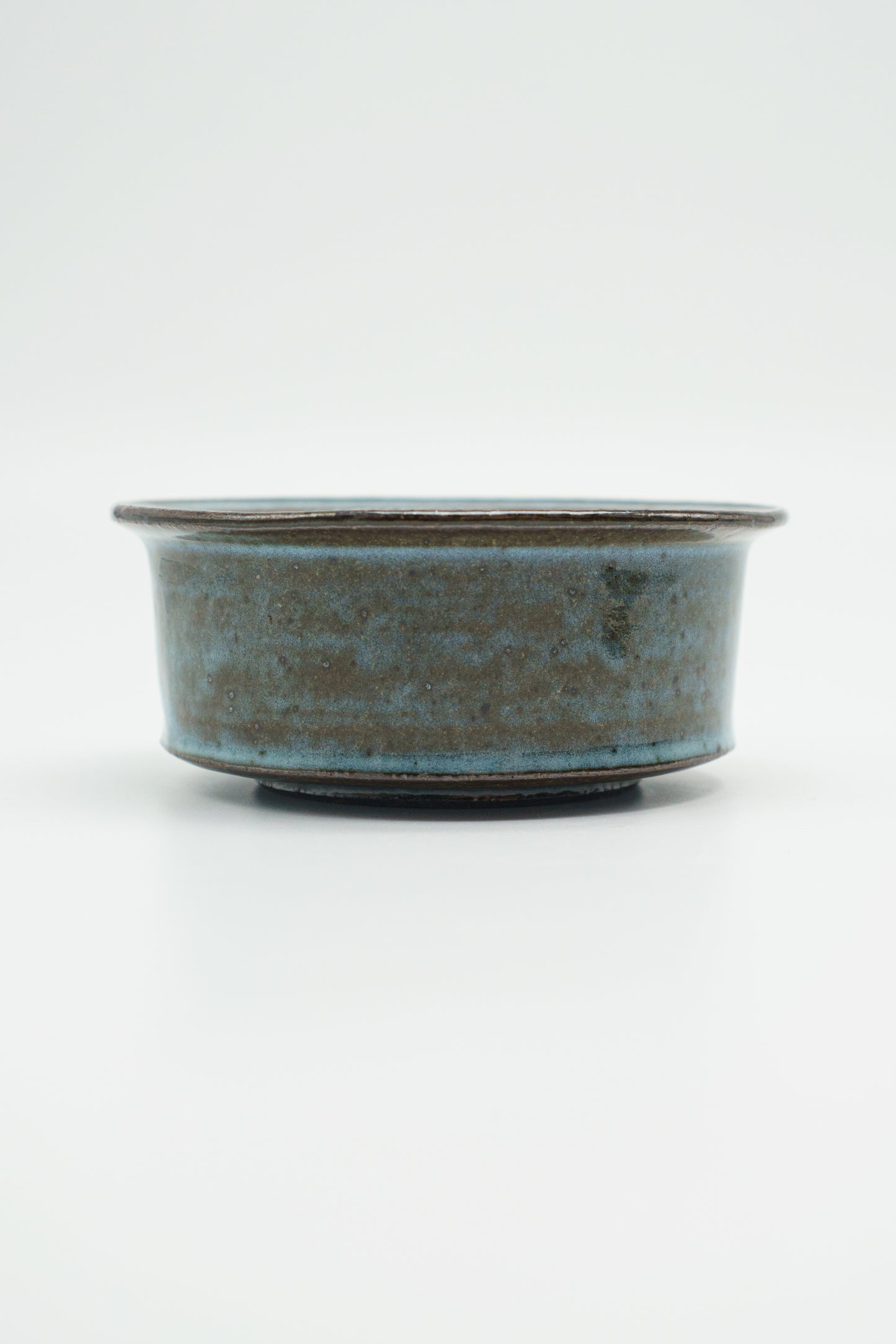 Icy Blue Zoetrope Bowl on Dark Clay