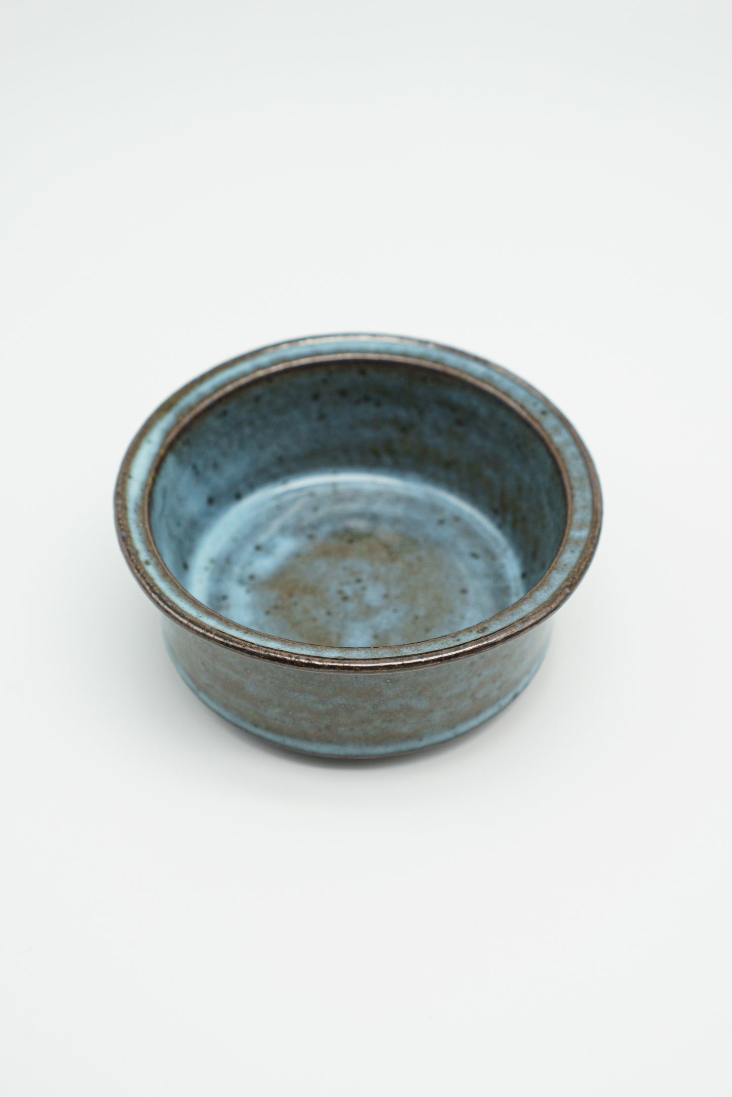Icy Blue Zoetrope Bowl on Dark Clay