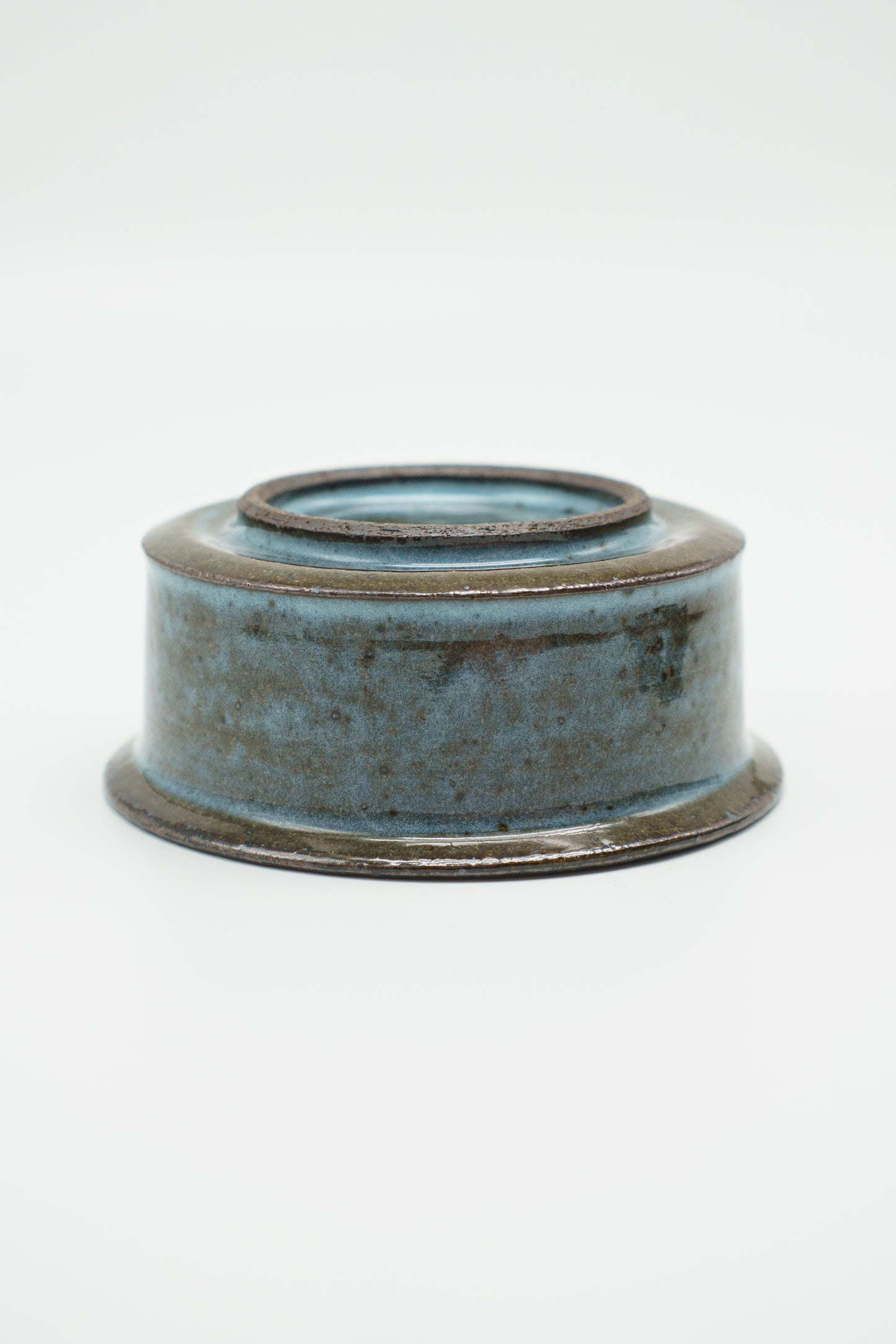 Icy Blue Zoetrope Bowl on Dark Clay