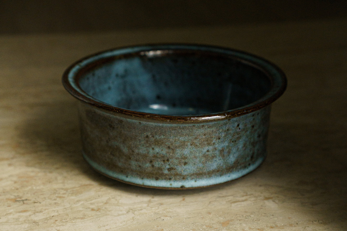 Icy Blue Zoetrope Bowl on Dark Clay