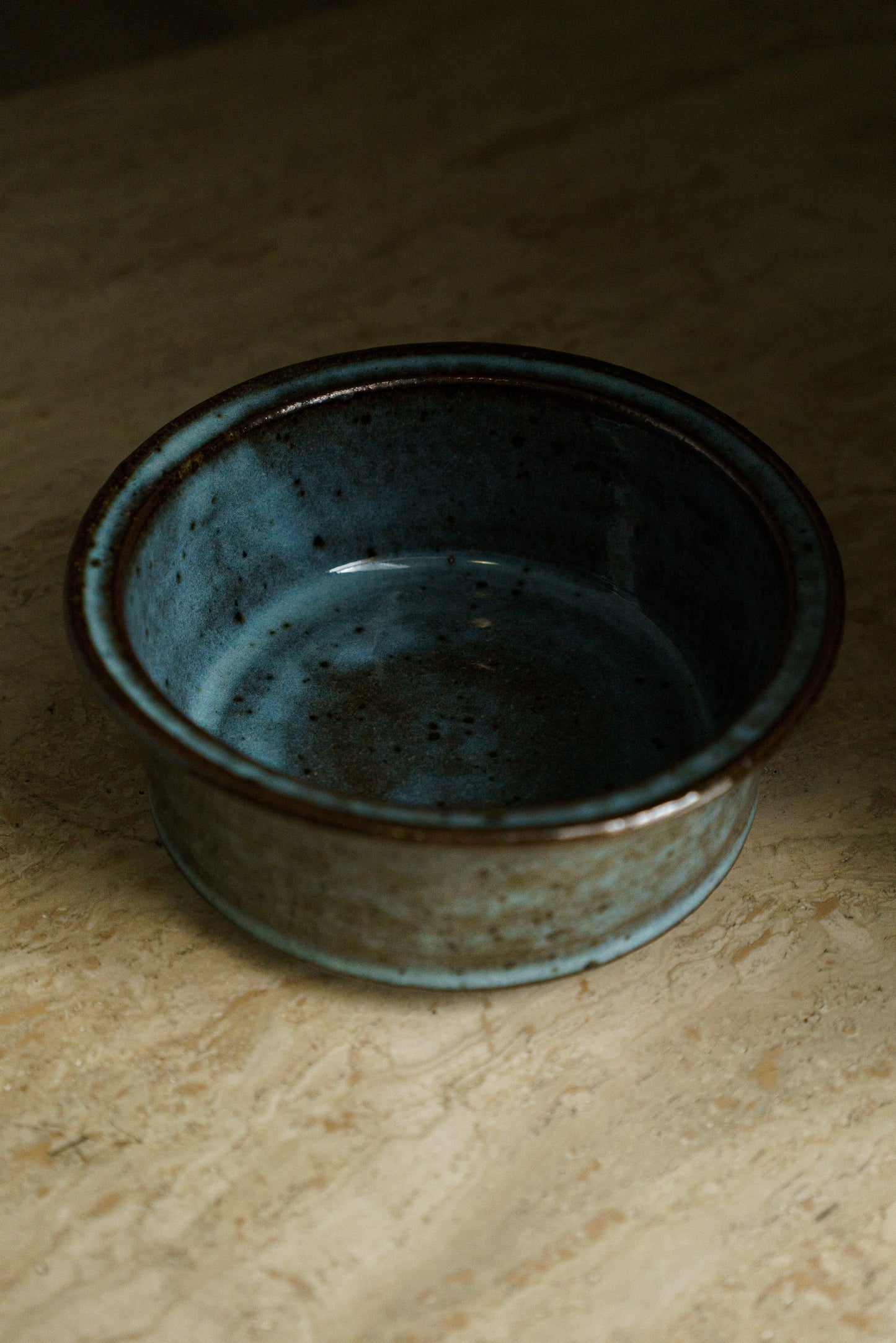 Icy Blue Zoetrope Bowl on Dark Clay