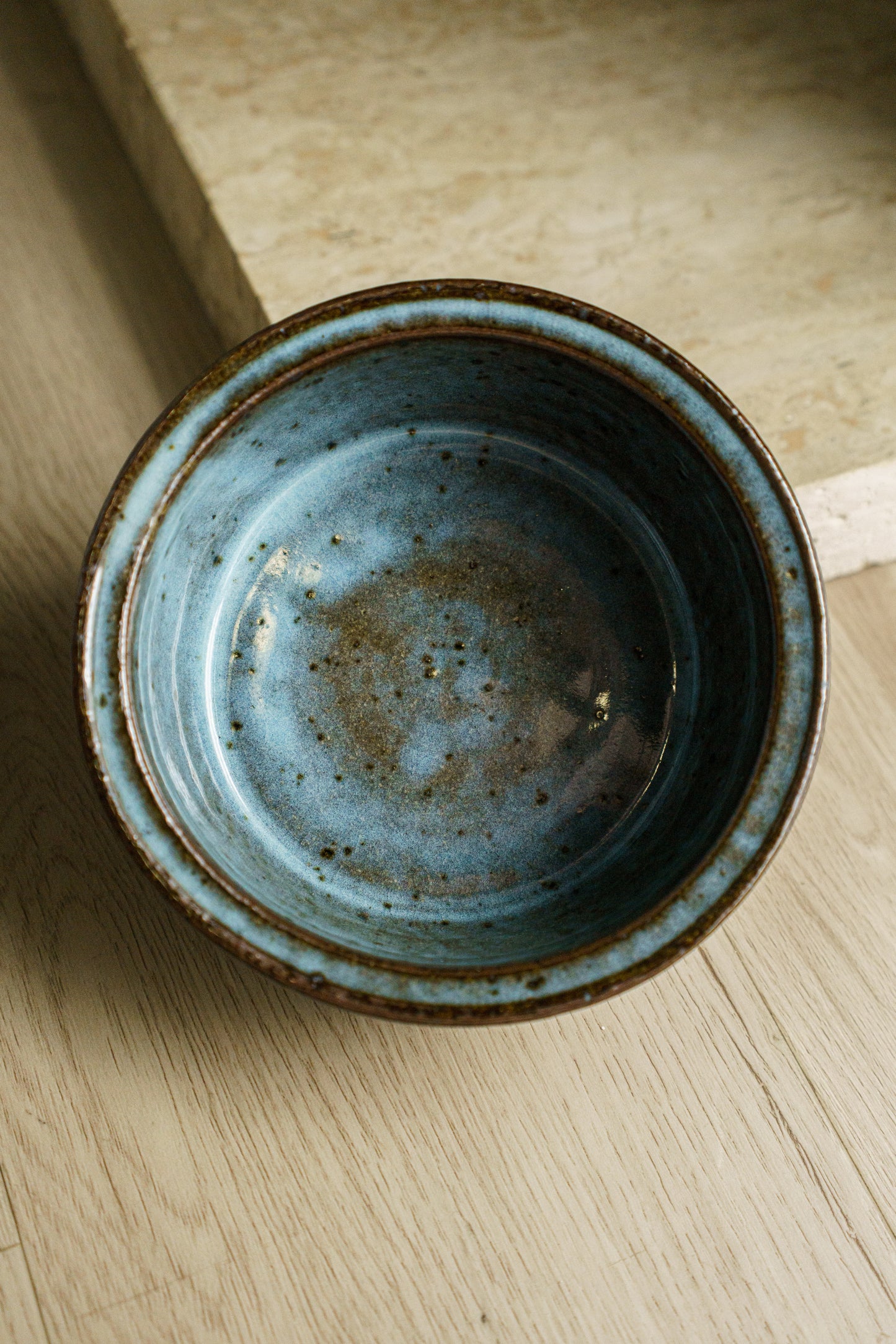 Icy Blue Zoetrope Bowl on Dark Clay