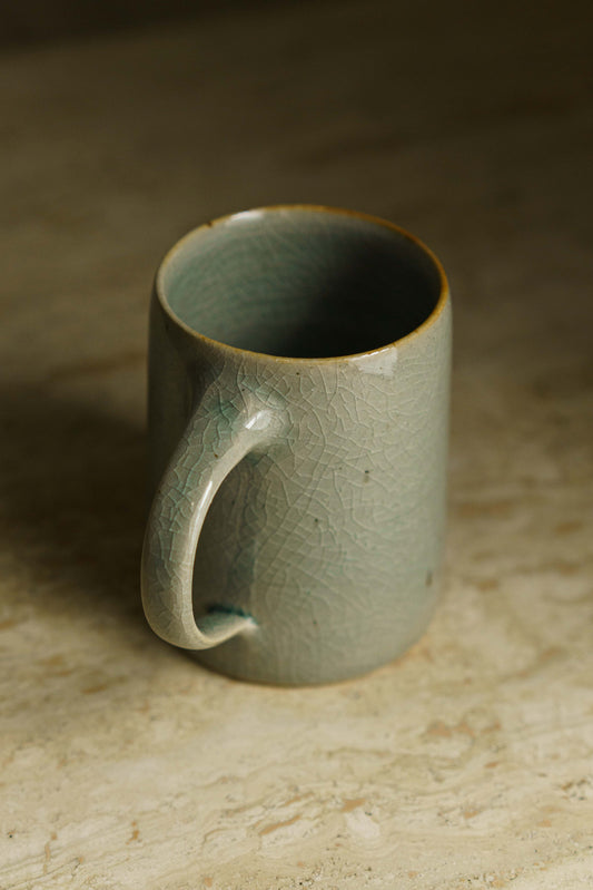 Tall slender mug in celadon.