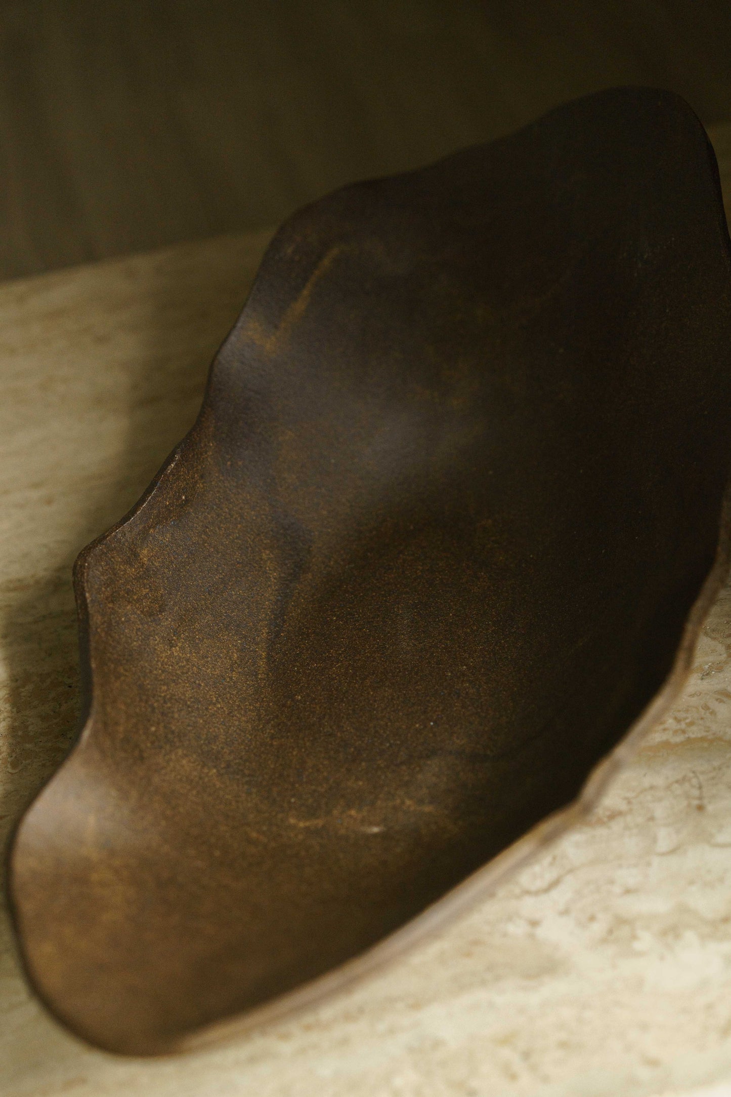 Large brown oblong raw clay bowl