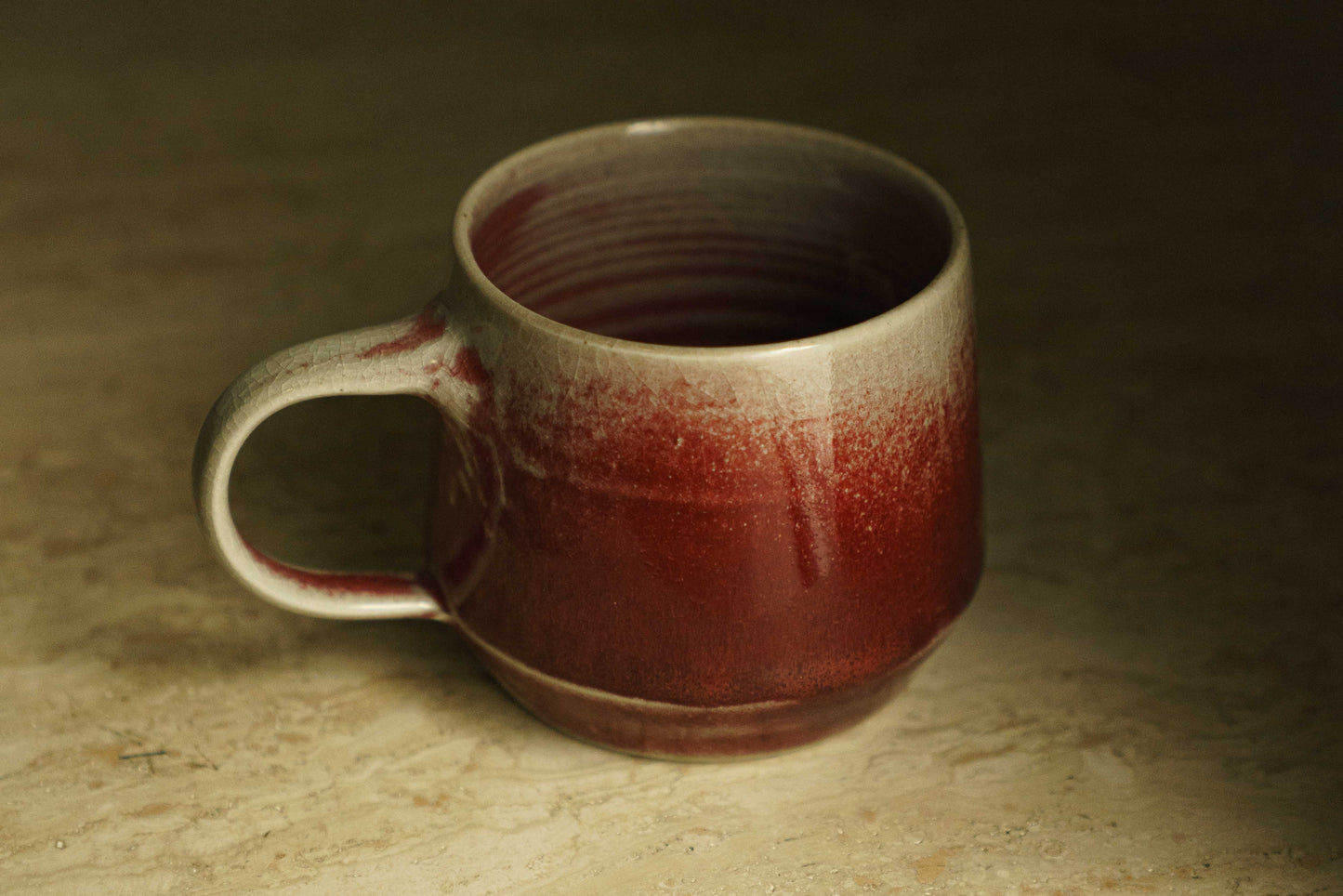 Ceramic mug with gradient from white to cranberry red