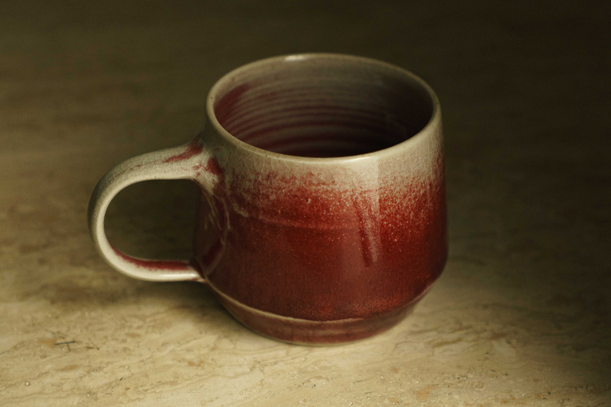Ceramic mug with gradient from white to cranberry red