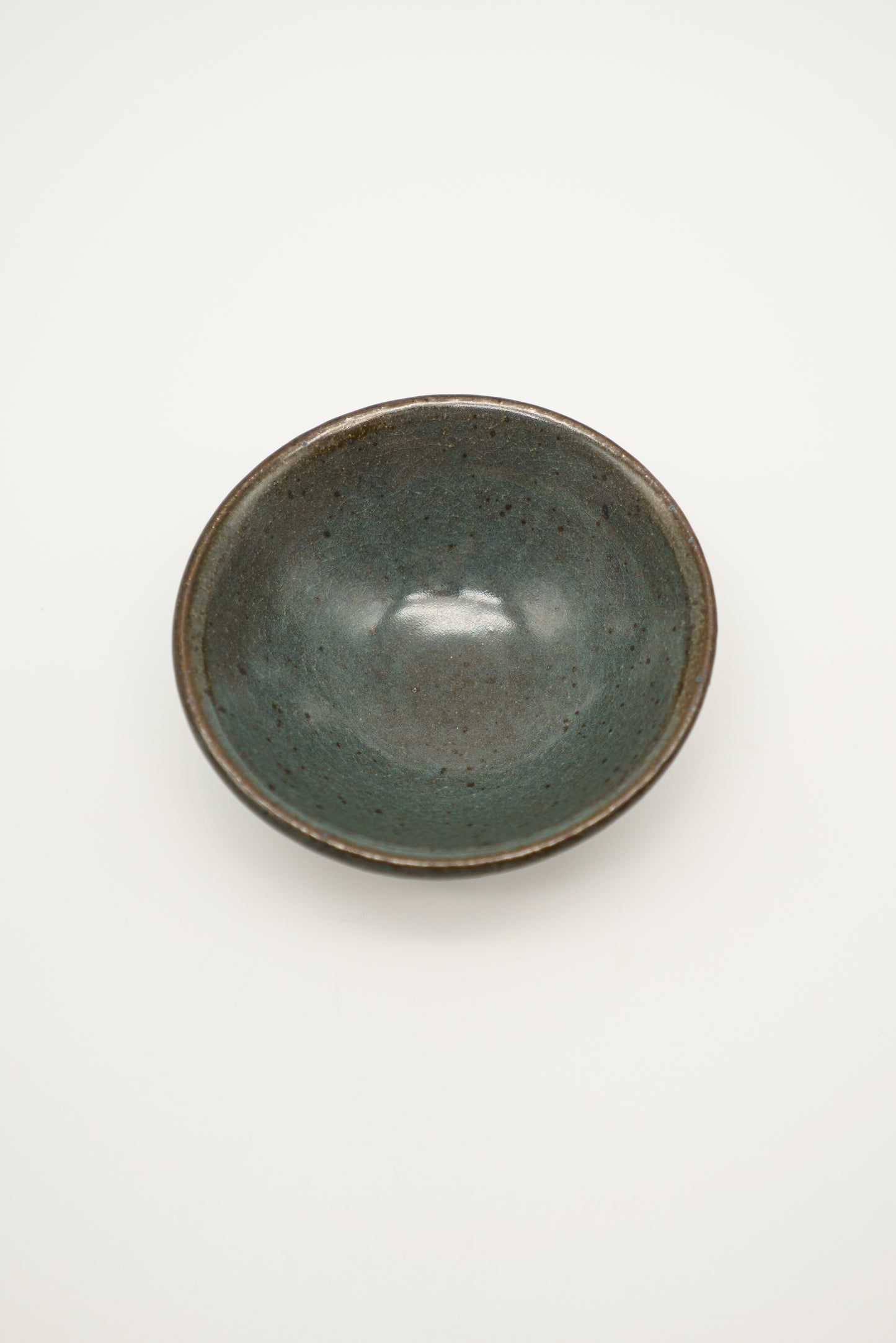 Matte Translucent Turquoise Bowl in Dark Clay