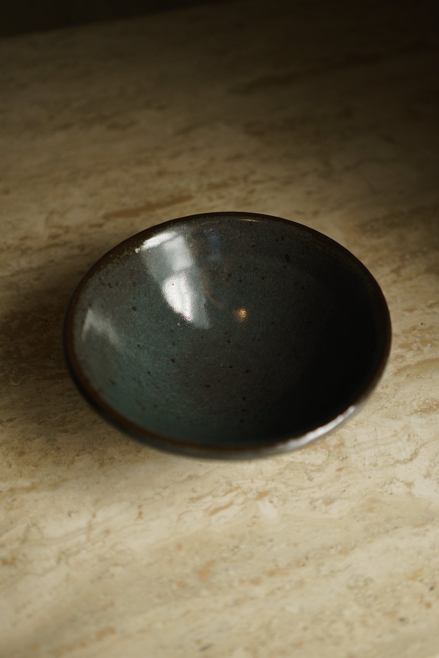 Matte Translucent Turquoise Bowl in Dark Clay
